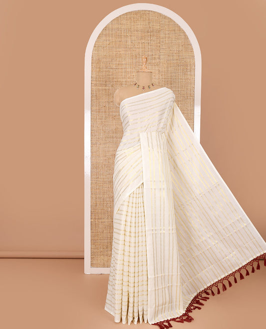 Borderless cream and maroon horizontal muthu zari striped Kerala cotton saree, self-pallu with tassels, and a matching blouse