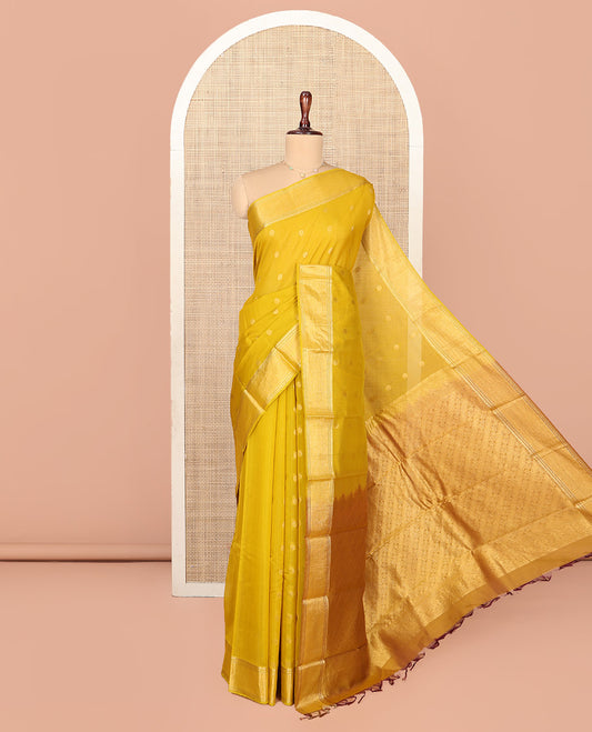 Yellow Silk Cotton Saree, Subtly Woven with Buttas All Over Its Body, Highlighted by Zari Border, Diagonally Woven Pallu and Paired with a Matching Blouse