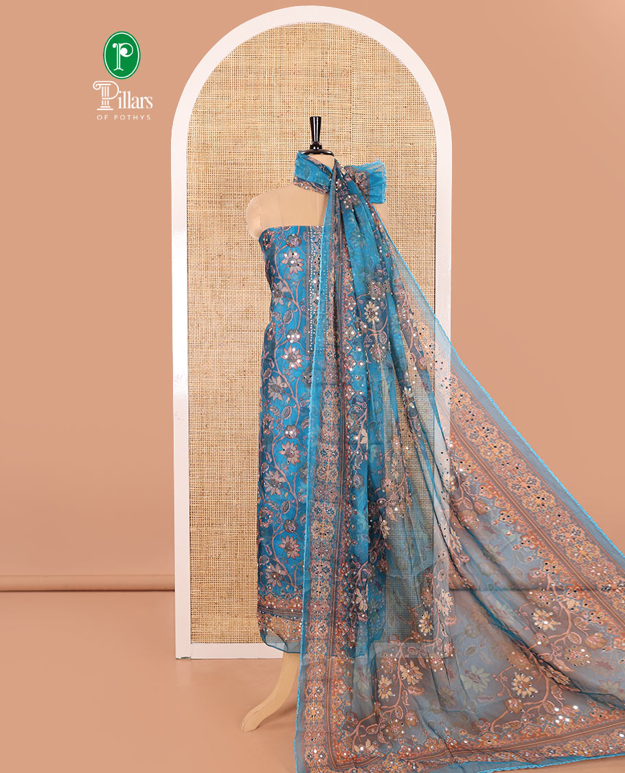 Blue Material Chudidar Set Embellished with Floral Vine with Mirror Work Organza Top, Subtly Made Plain Santoon Bottom, and Organza Dupatta Featuring Floral Vine Print and Mirror Work