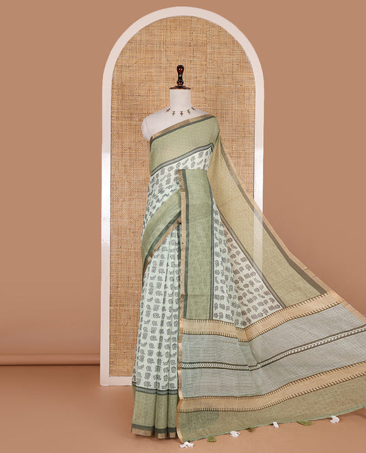Green cute elephant motifs printed linen cotton saree, contrast chevron border, pallu of stripes and chevron, and contrast printed blouse