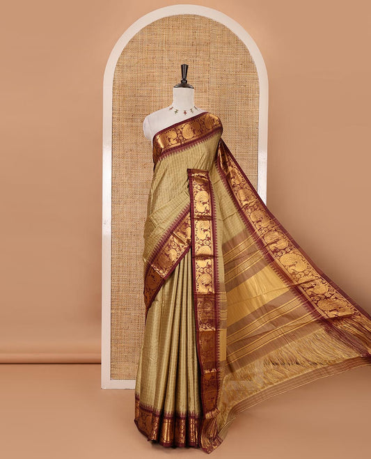 Green zari checked semi-taffeta silk saree, contrast annam motifs zari woven temple border, striped pallu & contrast striped zari border blouse