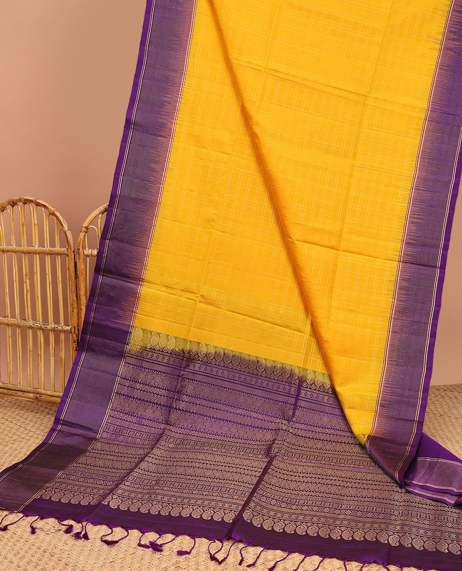 Yellow soft silk saree with contrast striped zari border & intricate zari design pallu