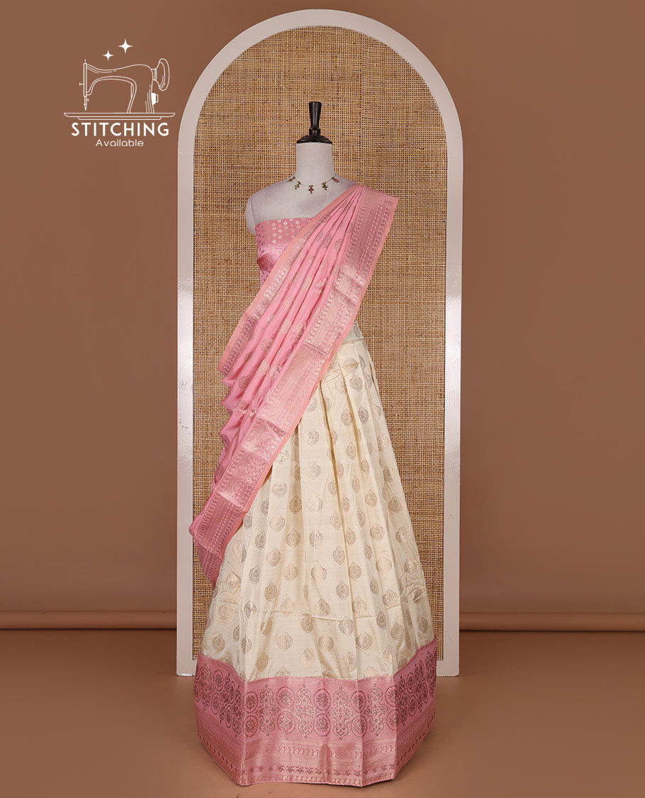 Cream and onion pink semi-banarasi half-saree, zari buttas with contrast swarovski stone work border skirt, contrast zari buttas blouse, and intricate zari dhavani