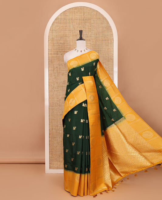 Bottle green peacock buttas dola silk saree, contrast kanchipuram-style traditional zari border, zari pallu & contrast zari border blouse