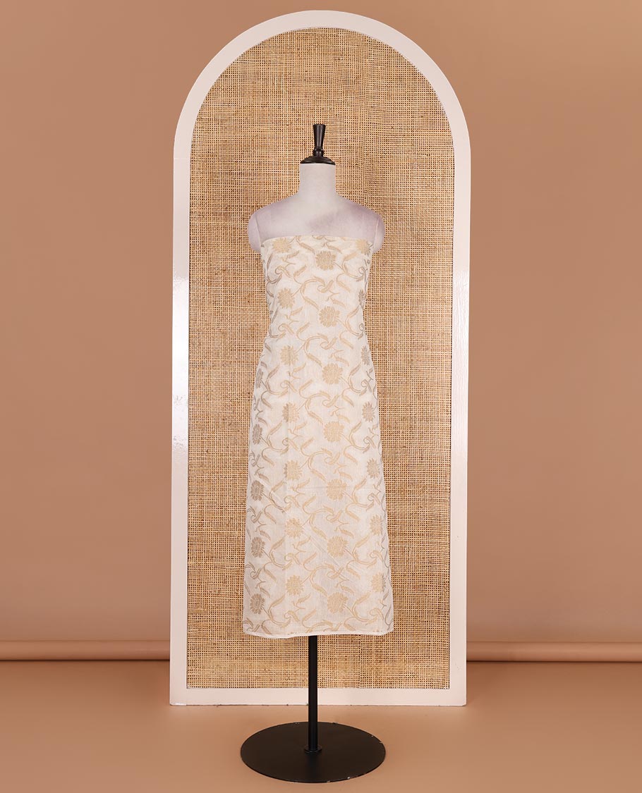 Cream with blue semi-chanderi material churidar set, floral jaal jacquard top, contrast taffeta silk bottom, and jamdani style dupatta