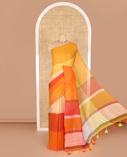 Borderless orange ombre-colored striped Khadi mul cotton saree, multi-colored tasseled pallu, and a matching blouse