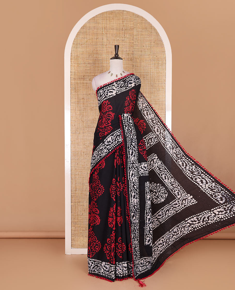 Black-Maroon batik floral printed soft cotton saree, batik printed pom-pom tasseled border, batik floral printed pallu, and a matching blouse