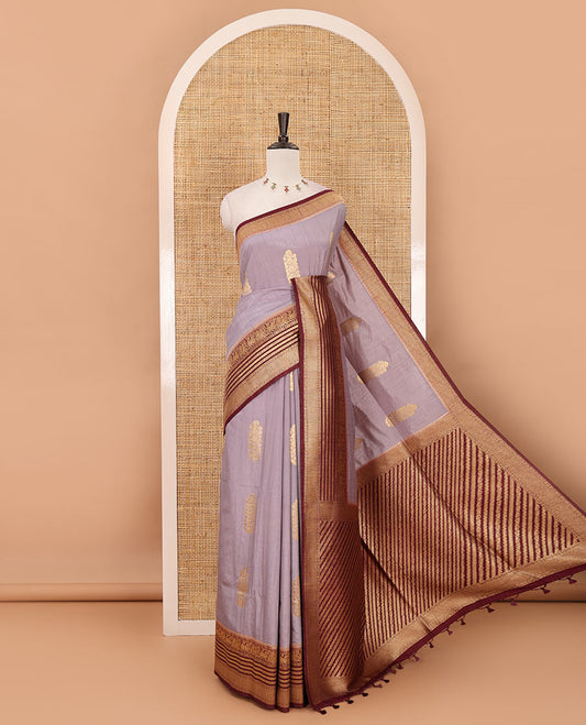 Light lavender floral zari buttas dola silk saree, contrast traditional zari peacock border, diagonal floral zari striped pallu & contrast jacquard blouse