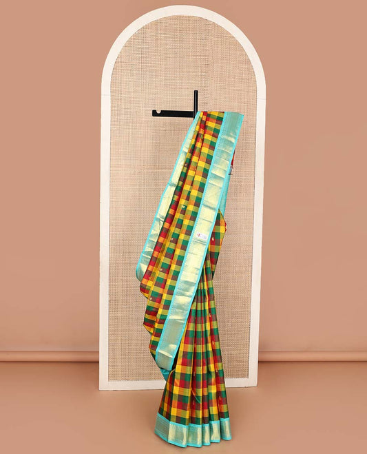 Multi-color paalum pazhamum checks, and buttas Kanchipuram korvai silk saree, contrast korvai border of thilakam mokku, muthu, and laddu kamalam, and annam chakram enclosed pallu
