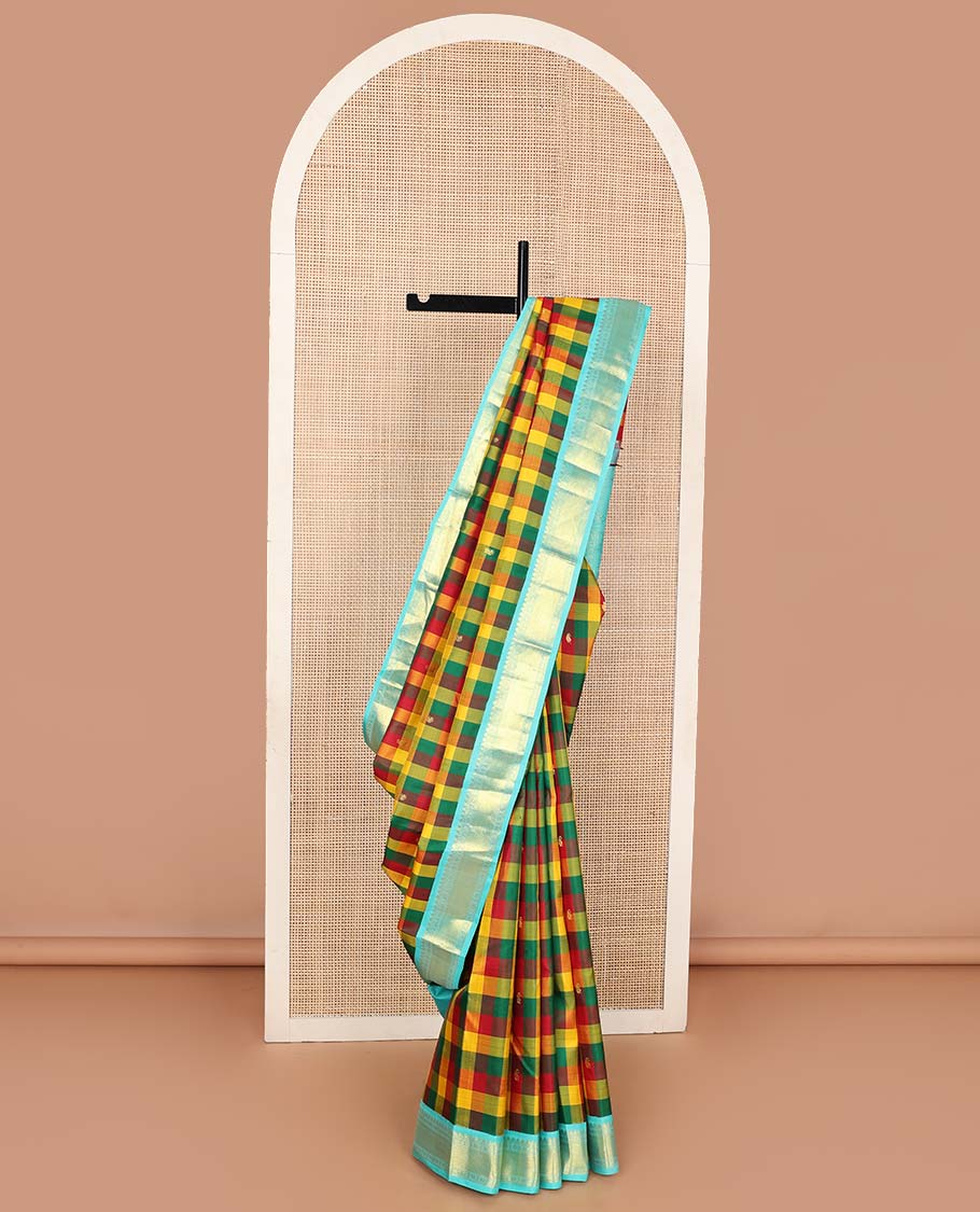 Multi-color paalum pazhamum checks, and buttas Kanchipuram korvai silk saree, contrast korvai border of thilakam mokku, muthu, and laddu kamalam, and annam chakram enclosed pallu