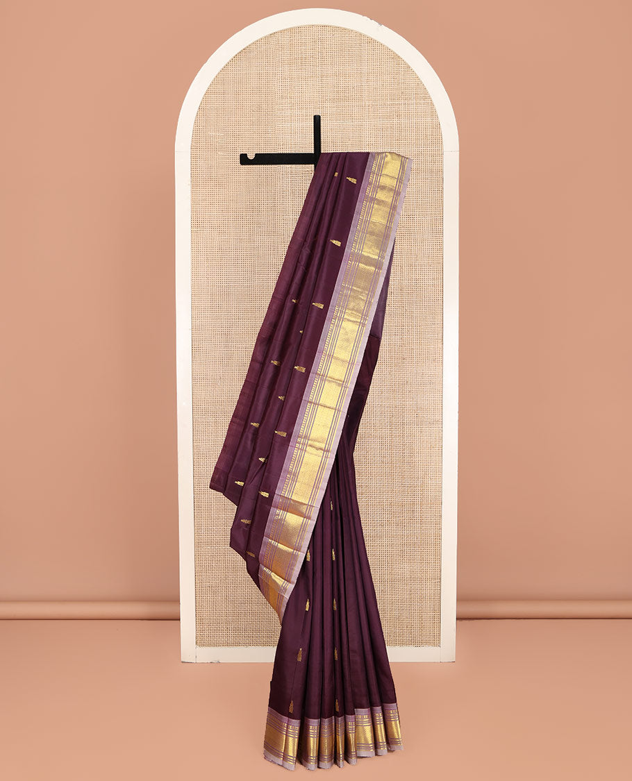 Brown Kanchipuram Silk Saree, Ornamented with Thazampoo Rekku Zari Buttas on Its Body, Complemented by Contrast One-Sided Border of Panner Sombu, Banaras, Muthu, and Mayil Kann Designs, Pallu Features Zari Designs, and Comes Without a Blouse