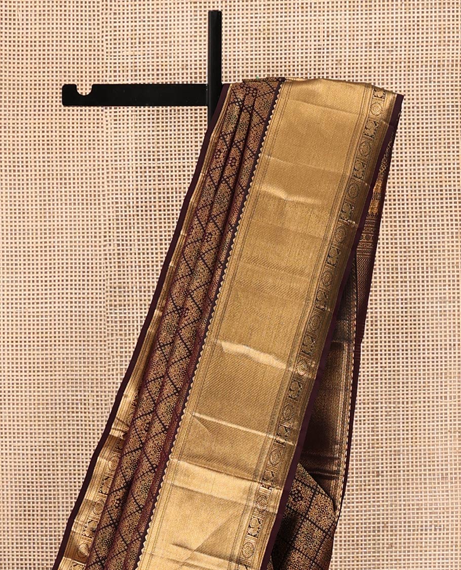 Brown Kanchipuram Wedding Silk Saree, Decked Up with Jacquard Design On Its Body, Highlighted by Zari Border of Rekku, Mayil and Chakram Designs, Grand Jaal Pallu and Paired with a Matching Blouse