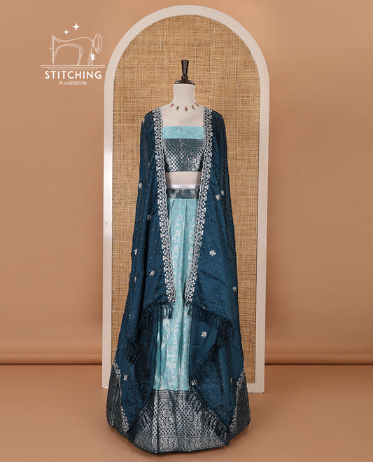 Blue banaras half-saree, zari jacquard & contrast traditional zari border skirt, zari woven blouse & contrast embroidered rangoli georgette scallop border dhavani