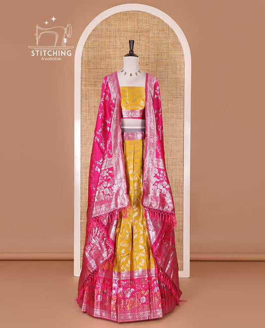 Haldi yellow taffeta silk half saree, floral jaal jacquard skirt, contrast rani zari meenakari style bird border, matching blouse, and floral jaal dhavani