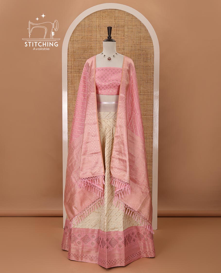 Cream semi-banaras half saree,leheriya zari skirt,contrast onion pink zari & swarovski stonework border,jacquard blouse & zari weave dhavani