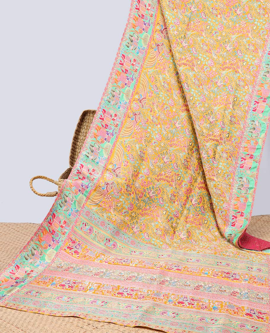 Yellow floral vine printed semi-banaras dola silksaree with contrast floral border & intricate animal motifs pallu