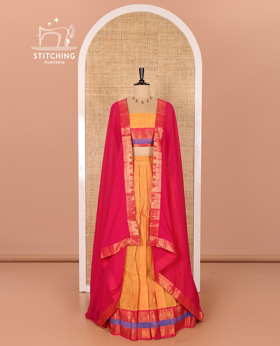 Mustard and Rani Pink Chettinad Cotton Half-Saree Featuring Buttas Woven Skirt, Highlighted with a Contrast Rettai Pettu Peacock Motifs Woven Zari Border, a Subtly Woven Matching Blouse, and a Vichitra Silk Contrast Traditional Zari-Bordered Dhavani