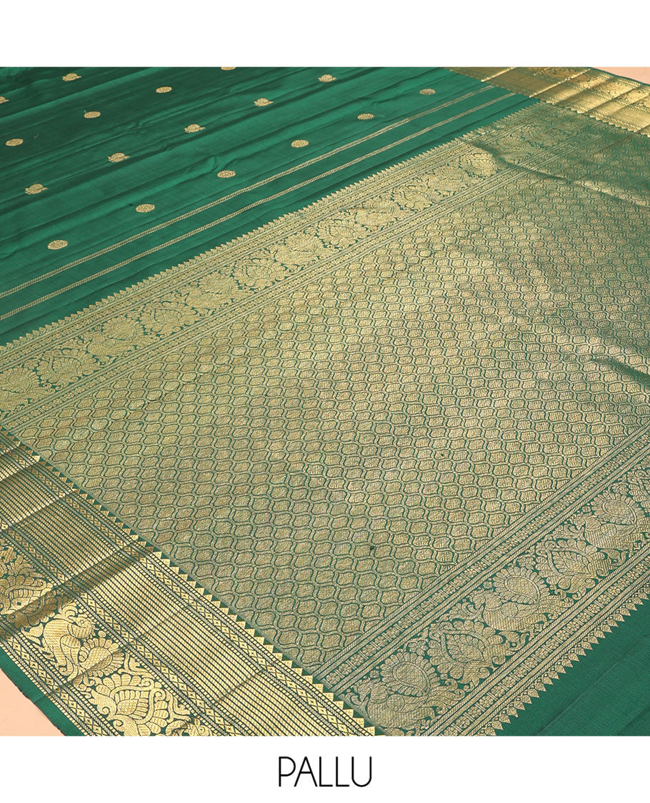 Green Kanchipuram Silk Saree, Elevated with Mayil-Chakram Buttas, a Zari Border of Rekku, Muthu, Mayil Kann, Banaras, Mayil, and Yaali Designs, Jaal Pallu, and a Matching Blouse
