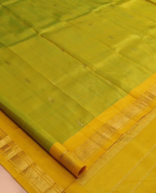 Green Kanchipuram Silk Saree, Subtly Woven with Zari Buttas, a Contrast One-Sided Border of Panner Sombu, Banaras, and Mayil Kann Designs, Zari Design Pallu, and No Blouse