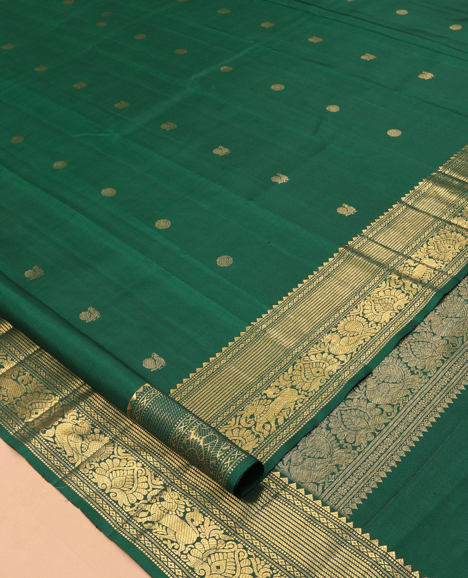 Green Kanchipuram Silk Saree, Elevated with Mayil-Chakram Buttas, a Zari Border of Rekku, Muthu, Mayil Kann, Banaras, Mayil, and Yaali Designs, Jaal Pallu, and a Matching Blouse