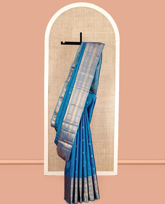 Blue Vasundhara Lite Silk Mix Saree Features Zari Buttas, a Zari Border of Kamalam, Ara Maadam, and Yaali, Pallu of Butta Enclosed Checks, and a Matching Blouse