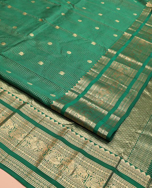 Green Vasundhara Lite Silk Mix Saree, Adorned with Mayil-Chakram Buttas and Zari Checks On Its Body, Highlighted by Zari Border of Rekku, Rudraksham, Mayil, and Kuthirai Designs, Grand Jaal Pallu and Paired with a Matching Blouse