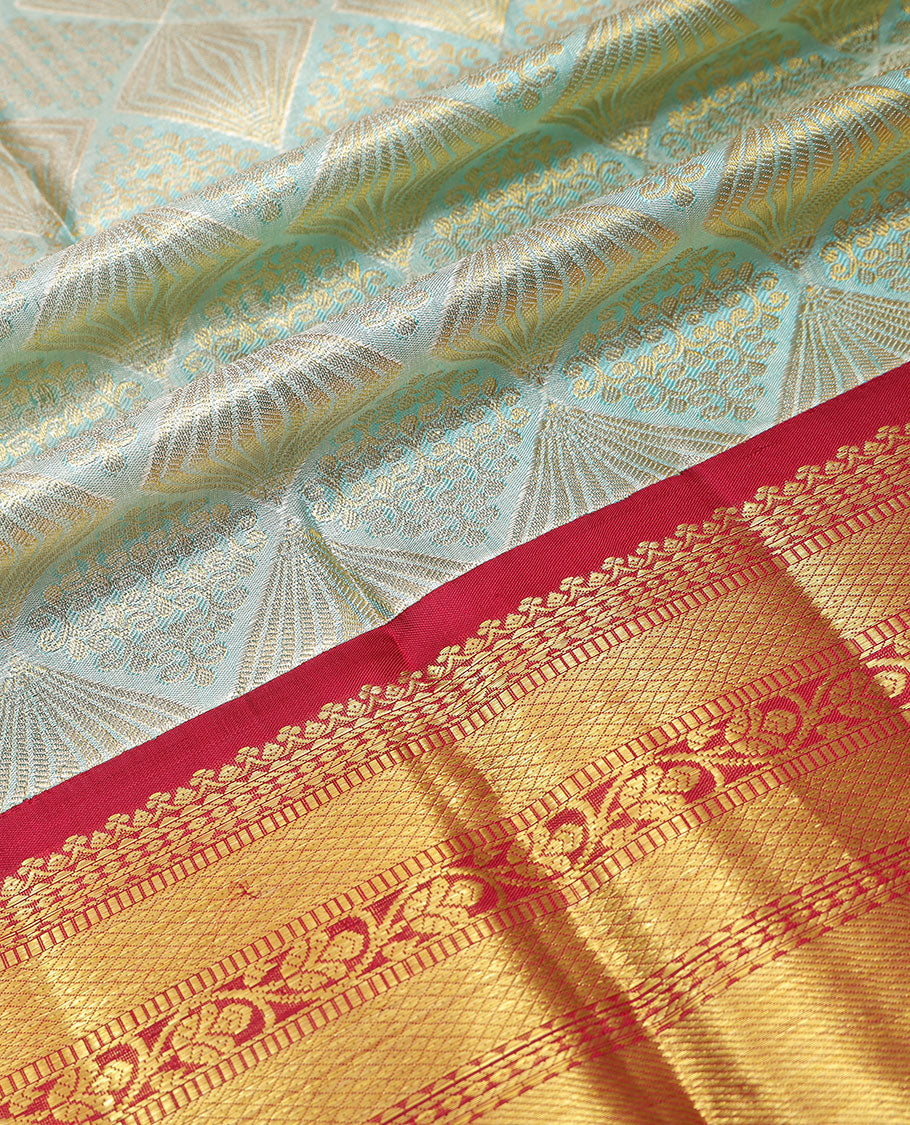 Light green floral design silk half saree with contrast thilakam mokku, kuyil kann, rekku design border, zari design blouse & zari design border dhavani