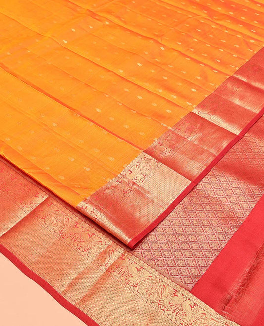Orange Vasundhara Lite Silk Mix Saree, Decked Up with Zari Buttas All Over Its Body, Complemented by a Contrast Border of Thilakam, Mayil, and Scallop Designs, Grand Jaal-Design Pallu, and Paired with a Contrast Blouse