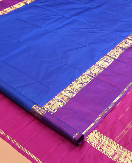 Royal Blue Plain Kanchipuram Silk Saree, a Contrast Rettai Pettu Border of Thazampoo Rekku, Banaras, Neli, Mayil, and Yaanai Designs , Zari Design Pallu, and a Contrast Blouse
