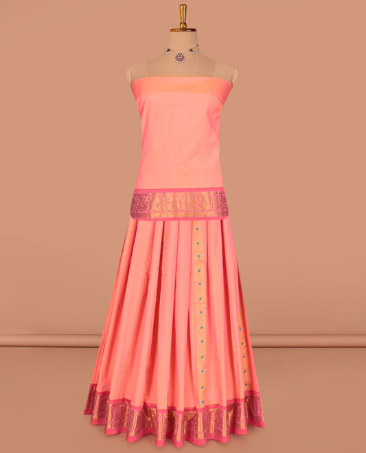 Peach Art Silk Pavadai Material Set, Decked Up with Zari Designs on Its Skirt, Complemented by a Contrast Traditional Zari Border, and a Matching Blouse