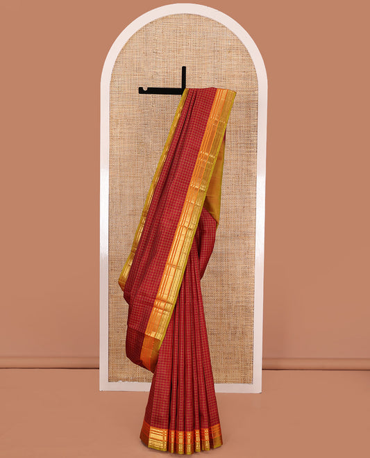 Red checked Kanchipuram silk saree, contrast border of salngai, kathir, mayil kann, and rudraksham designs, and zari striped pallu