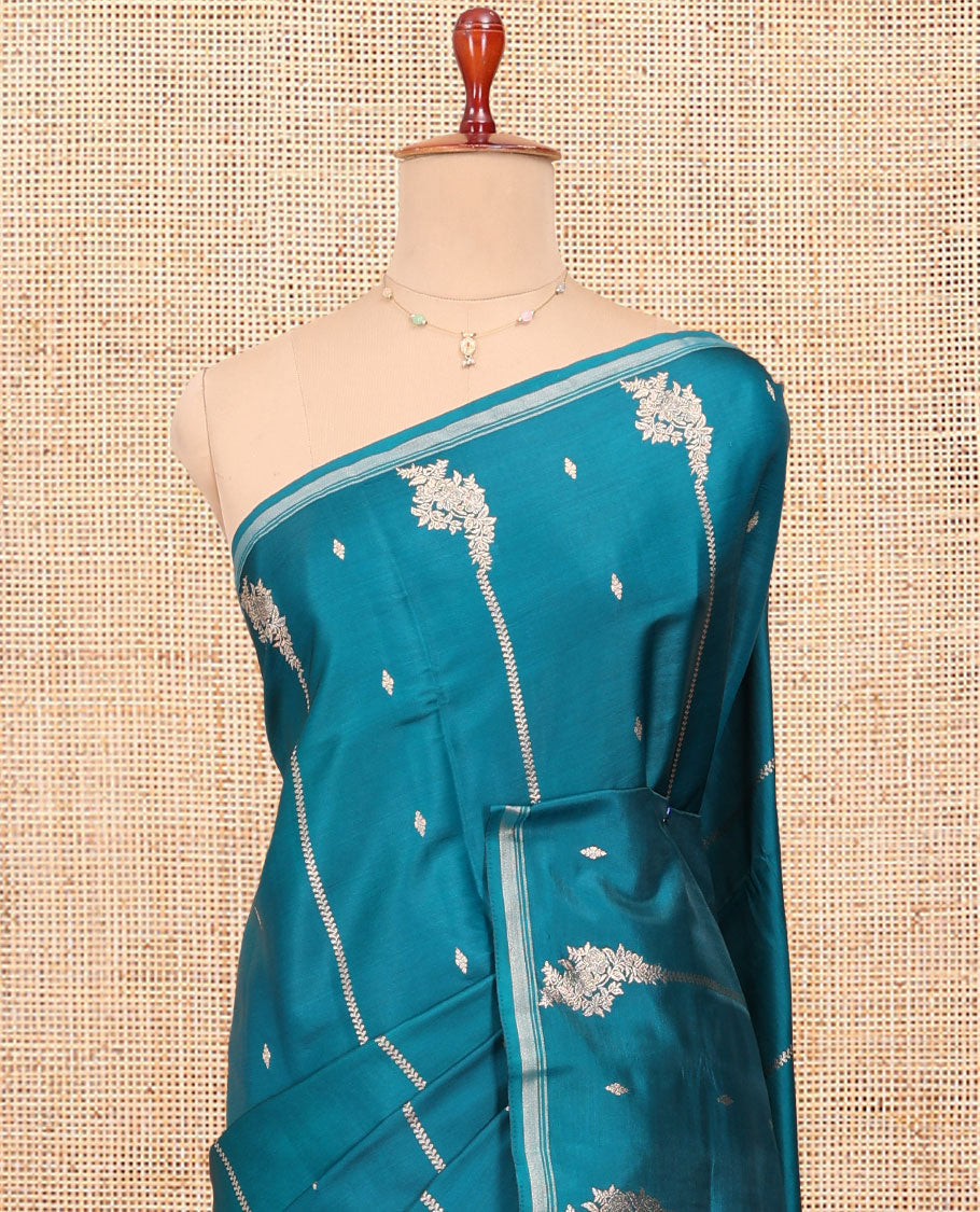 Peacock Blue Satin Silk Saree, Steeped in Richness of Floral Design All Over Its Body, a Subtle Zari Piping Border, Complemented by a Contrast Jaal Design Pallu, and Paired with a Contrast Blouse