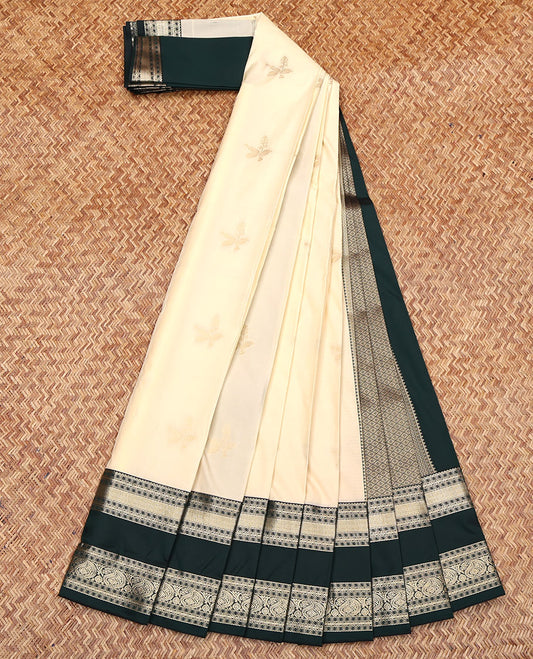 Cream Budget Silk Saree, Finely Crafted with Zari Buttas All Over Its Body, Complemented by a Contrast Traditional Zari Design Rettai Pettu Border, Grand Jaal Pallu, and Paired with a Contrast Blouse