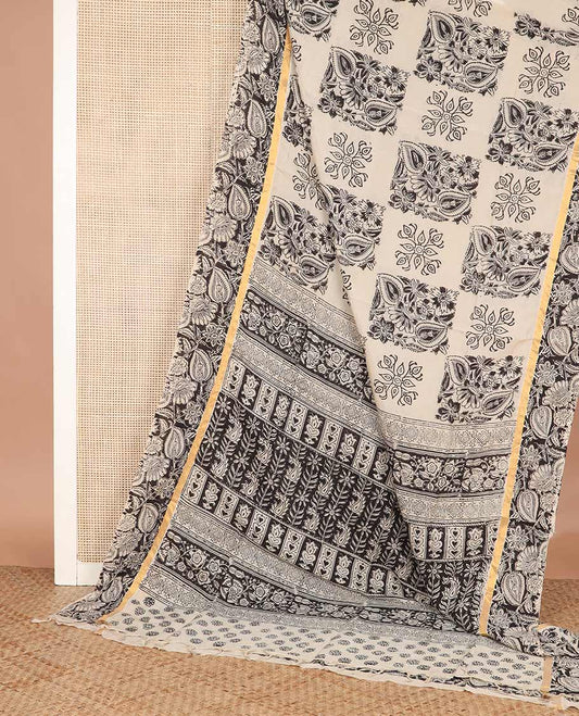 Cream floral buttas machine-printed Kalamkari cotton saree, contrast floral vine printed border, and pallu of paisley designs