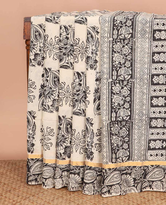 Cream floral buttas machine-printed Kalamkari cotton saree, contrast floral vine printed border, and pallu of paisley designs