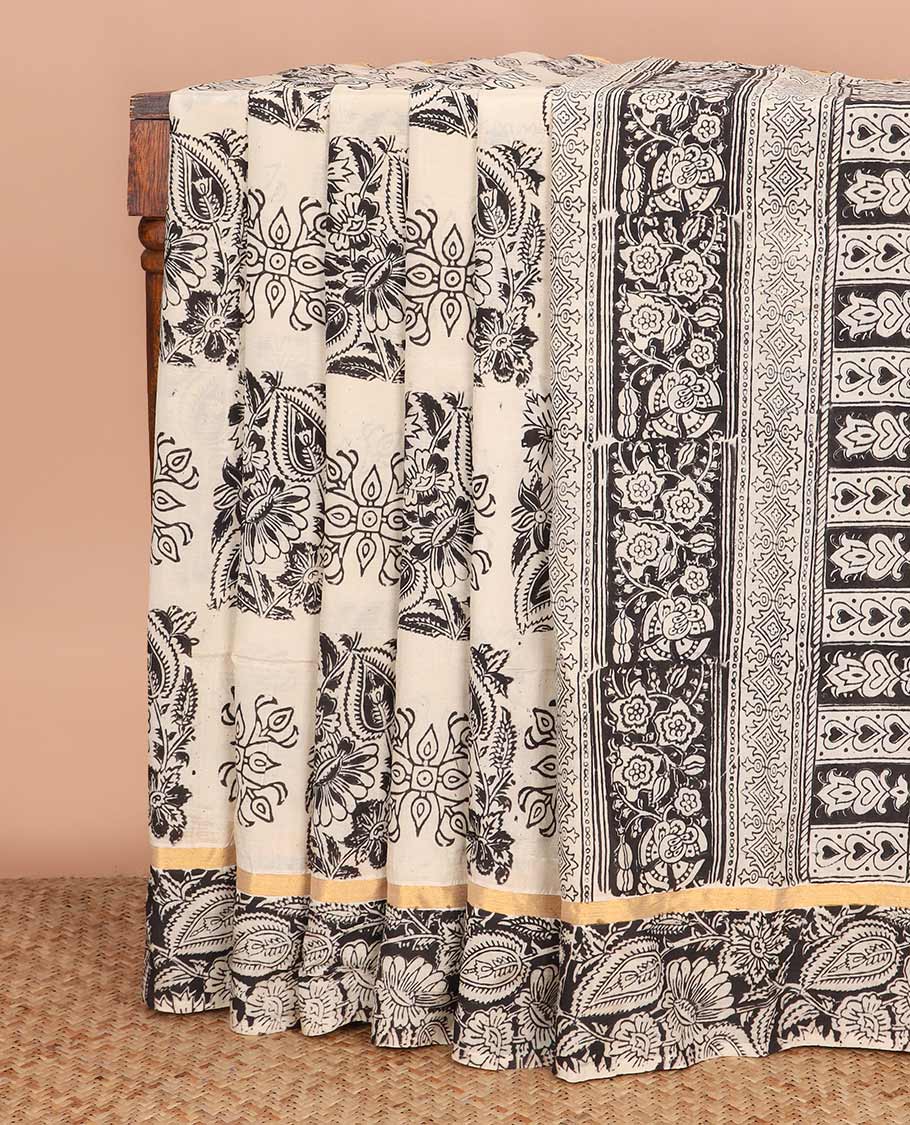 Cream floral buttas machine-printed Kalamkari cotton saree, contrast floral vine printed border, and pallu of paisley designs