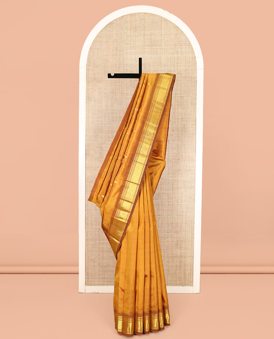 Mustard Kanchipuram Silk Saree, Adorned with Zari Buttas, a Contrast One-Sided Border of Panner Sombu, Banaras, Muthu, and Mayil Kann Designs, Zari Design Pallu, and No Blouse