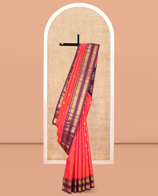 Orange Kanchipuram Silk Saree, Graced with Mayil-Chakram Buttas, a Contrast Korvai Rettai Pettu Border of Muthu, Muthu, and Kuthirai Designs, Traditional Pallu, and a Contrast Blouse
