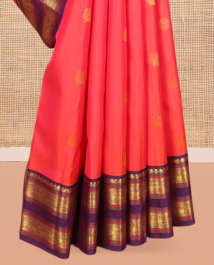 Orange Kanchipuram Silk Saree, Graced with Mayil-Chakram Buttas, a Contrast Korvai Rettai Pettu Border of Muthu, Muthu, and Kuthirai Designs, Traditional Pallu, and a Contrast Blouse