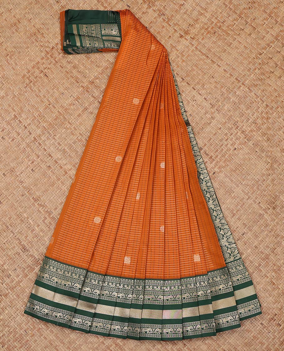 Orange Litchi Saree, Highlighted with Peacock-Chakram Buttas and Checks, a Contrast Traditional Zari Border, Intricate Pallu, and a Contrast Blouse