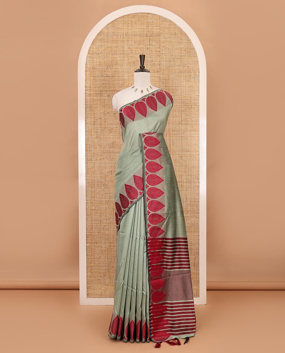 Pista green plain jute cotton saree , contrast leaf thread butta border & lining seer pallu with tussels