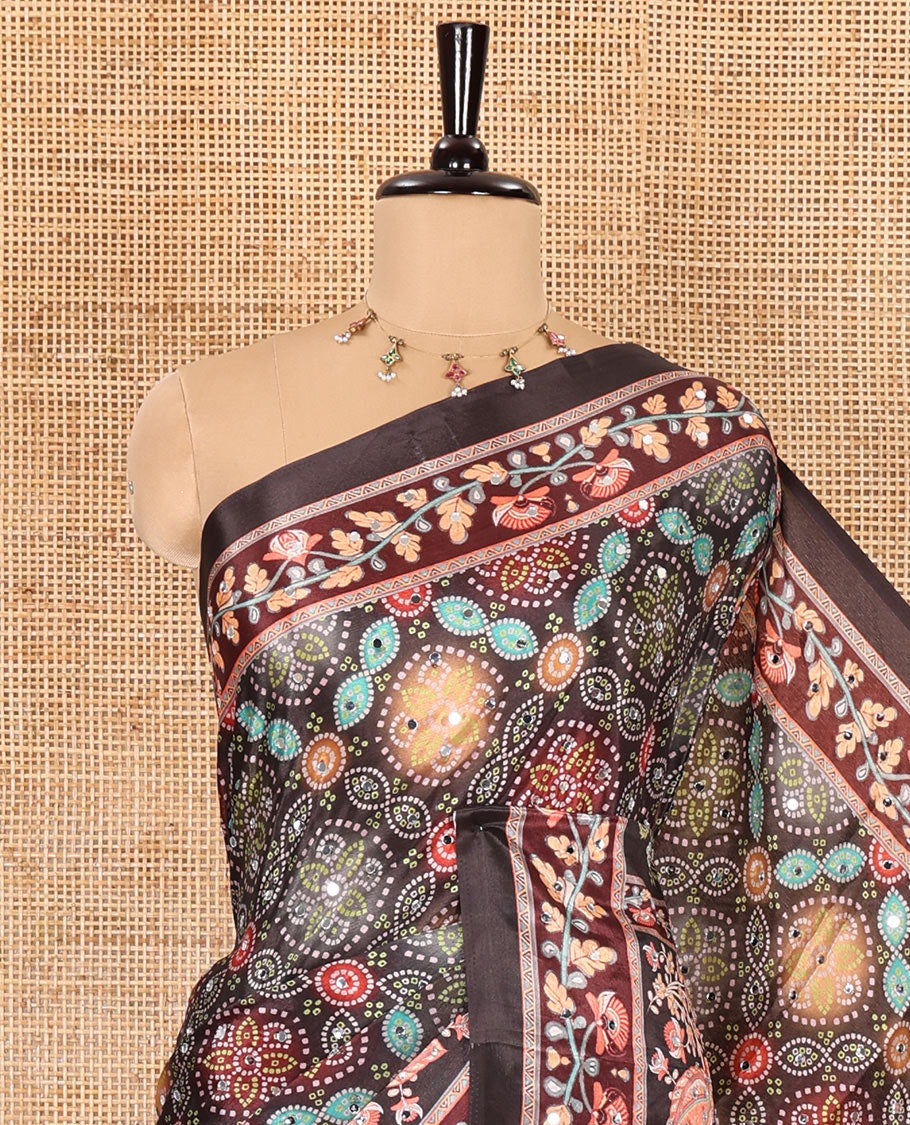 Black bandhani printed and mirror work masakali saree, floral creeper printed border, pallu of floral-peacock print, and a matching blouse