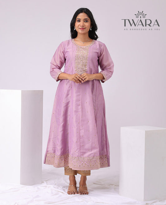 Twara lavender floral embroidered round neck , 3/4 th sleeve , bleow knee lenght a - line kuti with straight pants