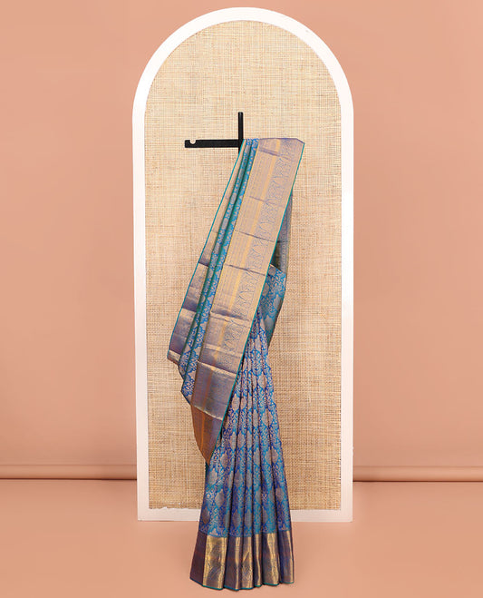 Blue Samudrika Silk Saree, Ornamented with Jacquard Design on Its Body, Highlighted by Zari Border of Rekku, Banaras, Cross Kamalam, Vanki, and Kodi Visiry Designs, Meticulously Crafted Pallu, and Paired with a Matching Blouse