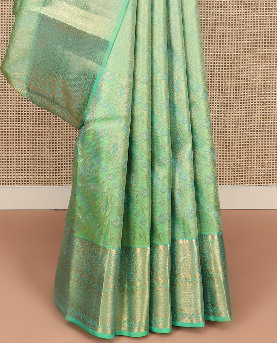 Green Kanchipuram Wedding Silk Saree Beautifully Bedecked with Meenakari Jacquard Designs, Highlighted with Contrast Border of Rekku, Kathir, and Kodi Visiry Designs, Grandly Decked Up Pallu of Jaal Designs, and Paired with a Contrast Blouse