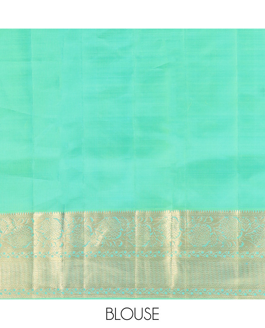 Green Kanchipuram Wedding Silk Saree Beautifully Bedecked with Meenakari Jacquard Designs, Highlighted with Contrast Border of Rekku, Kathir, and Kodi Visiry Designs, Grandly Decked Up Pallu of Jaal Designs, and Paired with a Contrast Blouse