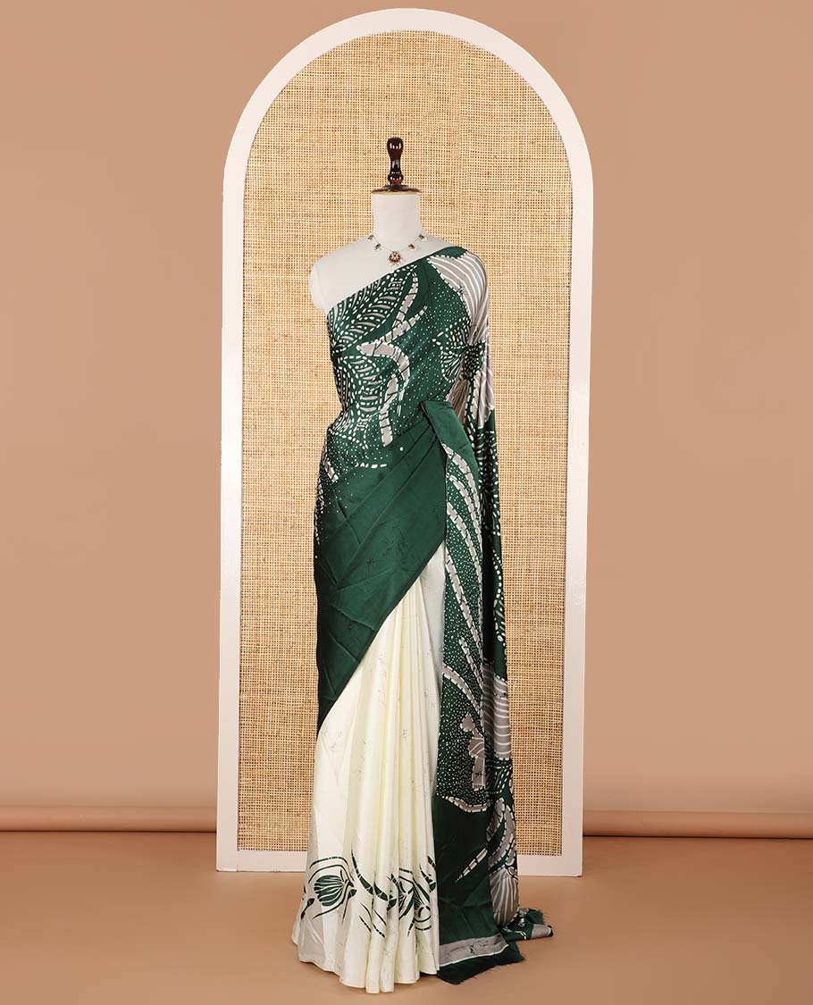 Borderless green half-and-half model satin saree with batik-style big floral motifs digital printed body and pallu