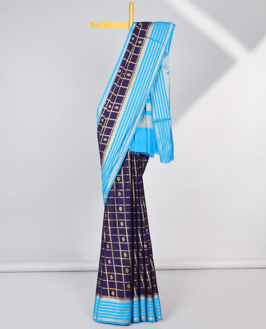 Violet floral motifs enclosed with checked mysore silk saree with contrast striped zari border & pallu of intricate design