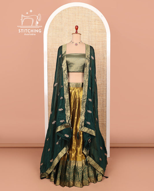 Gold-dark green zari buttas half-saree with contrast intricate Mughal motifs woven bordered skirt, brocade blouse, and a zari design dhavani