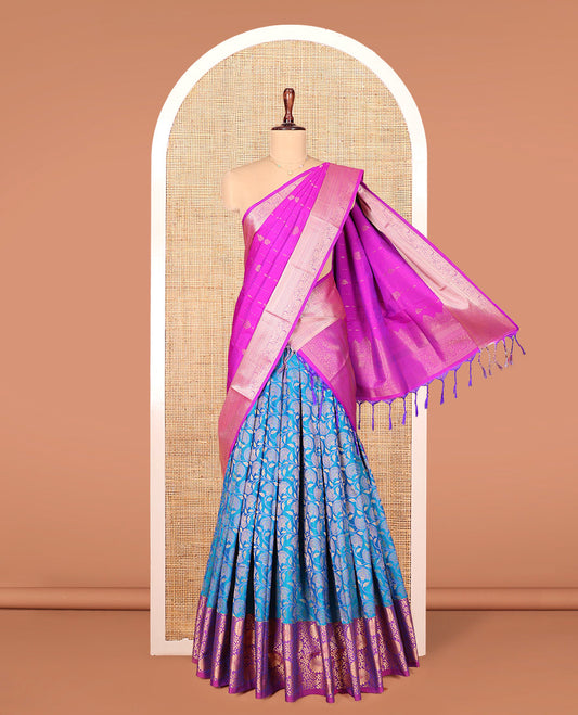 Blue Art Silk Material Half Saree Set, Majestically Detailed with Floral Jaal Jacquard Design on Its Skirt, Complemented by a Contrast Floral Zari Design Border, Paired with a Contrast Blouse, and Zari Design Dhavani